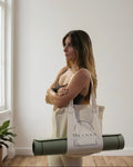 Natural cotton MOCA yoga mat carry bag with adjustable shoulder strap and embroidered MOCA logo.